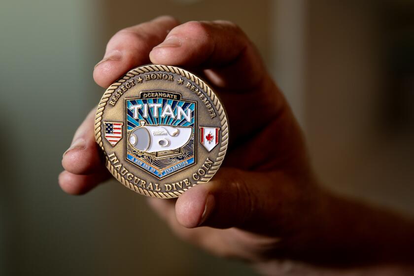 El Segundo, CA - June 22: Bill Price, shown holding a Titan inagural dive coin, a California man who went on dives in the Titan, the now-missing submersible that was exploring the Titanic wreckage. Photo taken in El Segundo Thursday, June 22, 2023. (Allen J. Schaben / Los Angeles Times)