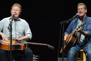 FILE - In this Jan. 15, 2014 file photo, Don Henley, left, and Glenn Frey of The Eagles perform at the Forum in Los Angeles. A list of six Kennedy Center honorees were announced Wednesday, which includes “Star Wars” creator George Lucas, groundbreaking actresses Rita Moreno and Cicely Tyson, singer Carole King, rock band the Eagles and acclaimed music director Seiji Ozawa. (Photo by John Shearer/Invision/AP, File)