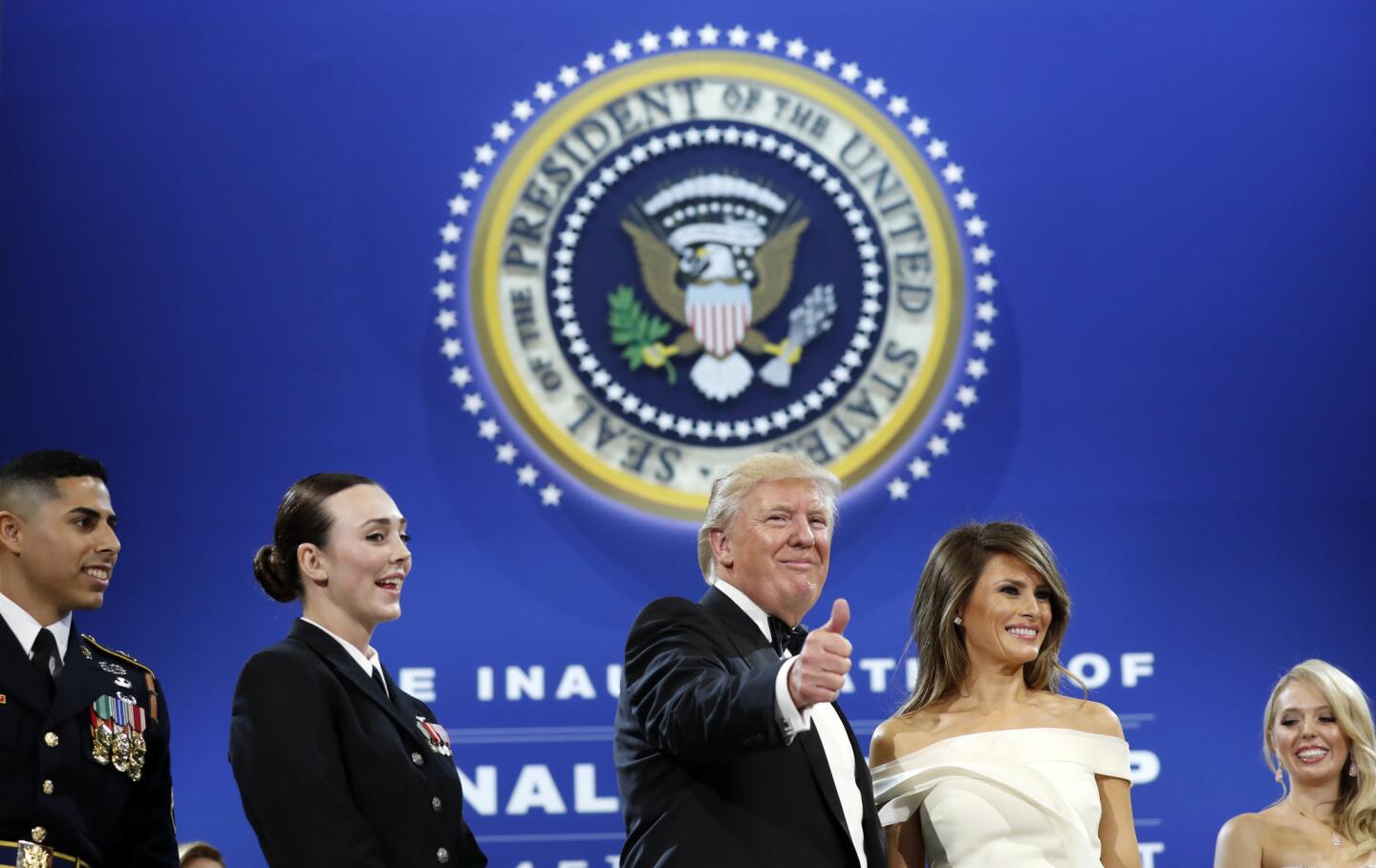 President Donald Trump gives a thumbs-up alongside first lady Melania Trump at the Salute To Our Armed Services Inaugural Ball in Washington, D.C., on Friday, Jan. 20, 2017. At left is Army Staff Sgt. Joseph A. Medina and second from left is Navy Petty Officer 2nd Class Catherine Cartmell.
