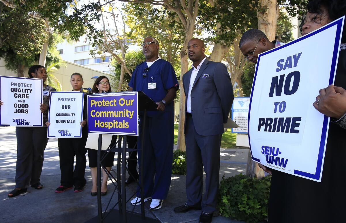 Radiology technician Tony Demartin speaks as healthcare workers and union organizers hold a press conference in August at St. Vincent Medical Center to protest the planned sale of six California hospitals to Prime Healthcare.