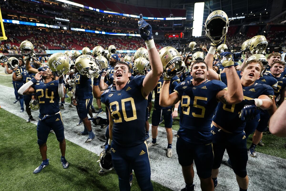 Georgia Tech players celebrate after defeating North Carolina on Sept. 25, 2021, in Atlanta.