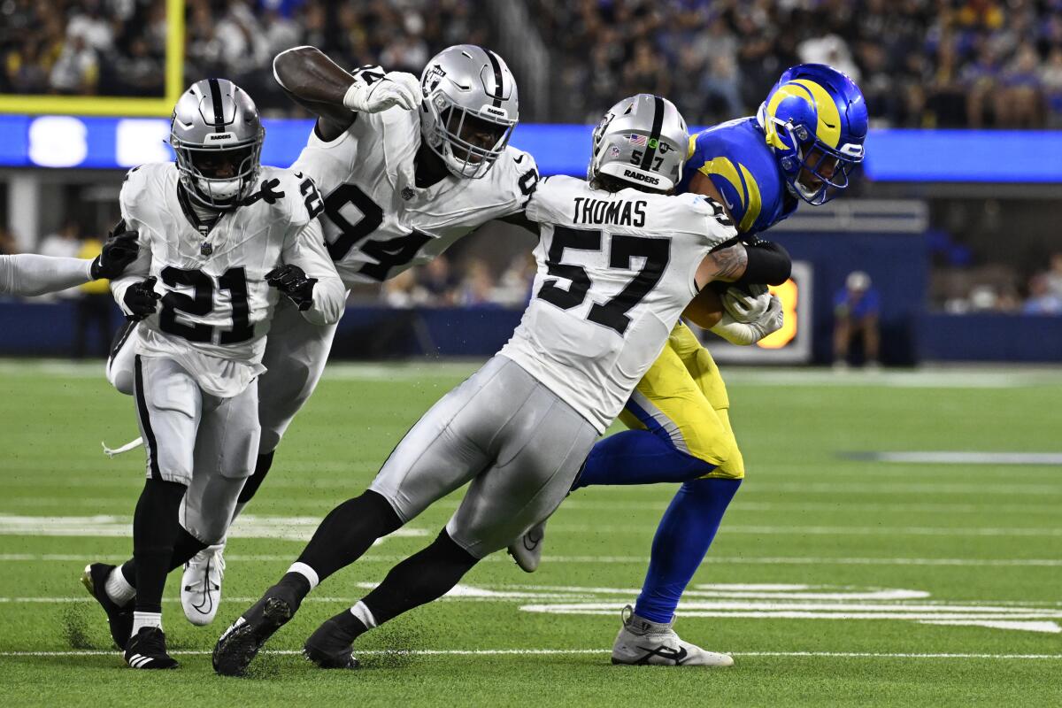 Davis Allen is tackled by the Raiders.