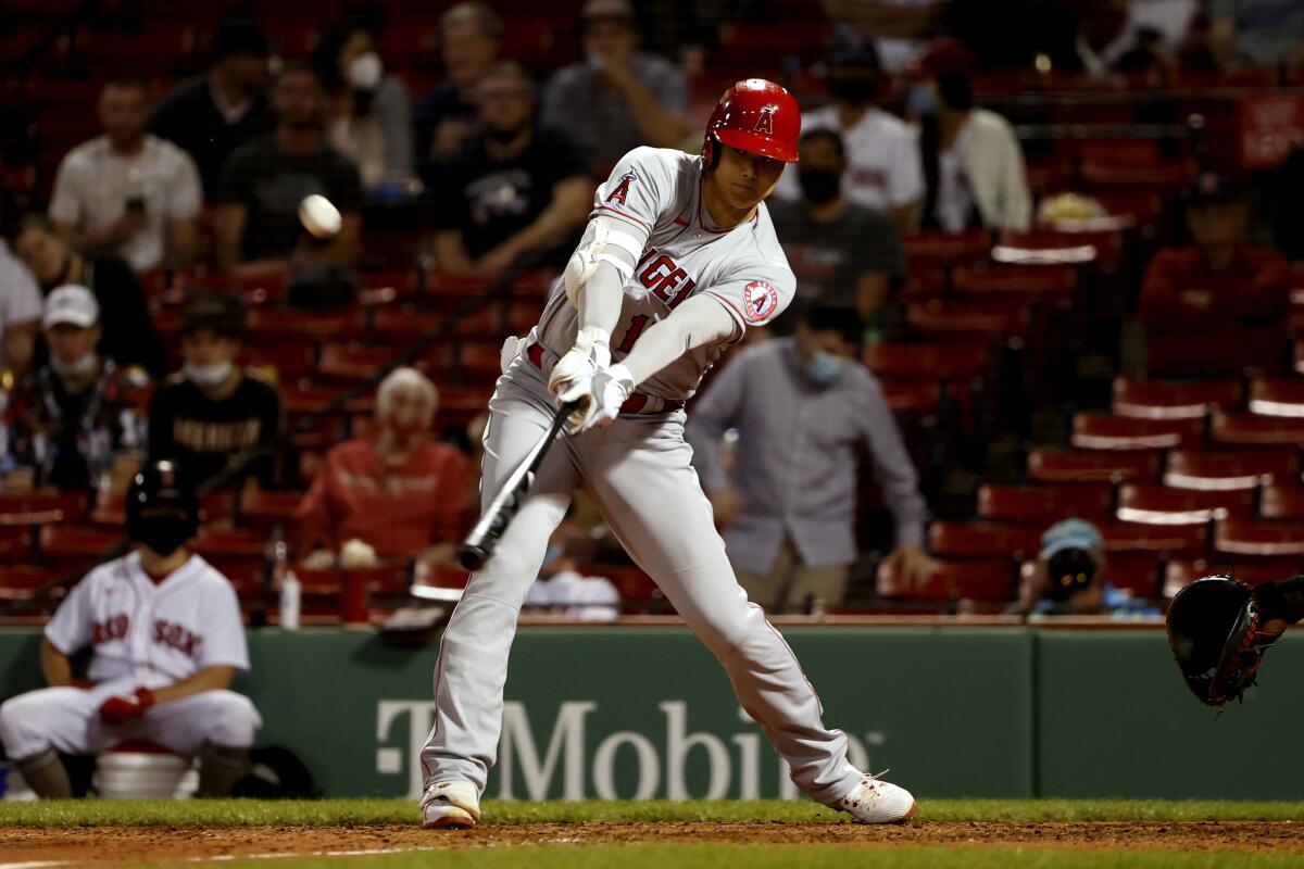 The Angels' Shohei Ohtani reaches out to hit a solo home run during the sixth inning May 14, 2021.