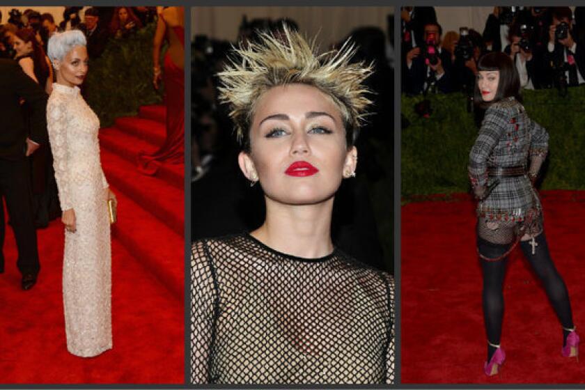 From left, Nicole Richie, Miley Cyrus and Madonna on the red carpet at the "Punk: Chaos to Couture" Costume Institute gala at the Metropolitan Museum of Art in New York City.