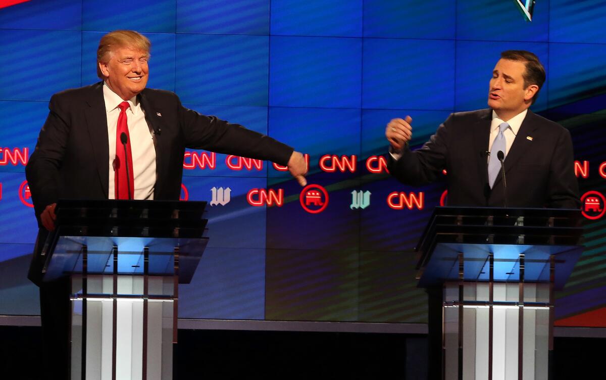 Republican presidential candidates Donald Trump and Sen. Ted Cruz interact during a debate at the University of Miami in Coral Gables, Fla. on March 10.