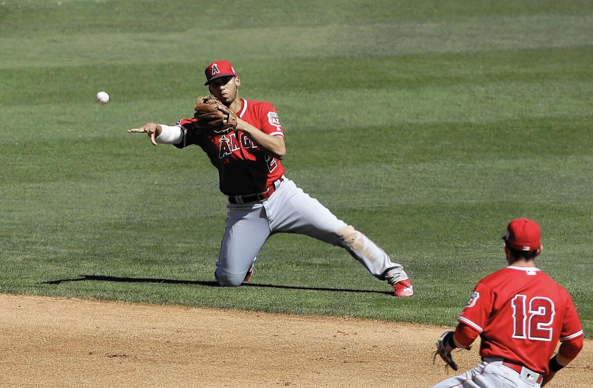 The Angels' Andrelton Simmons makes a play against the White Sox during a March spring training game in Glendale, Ariz.