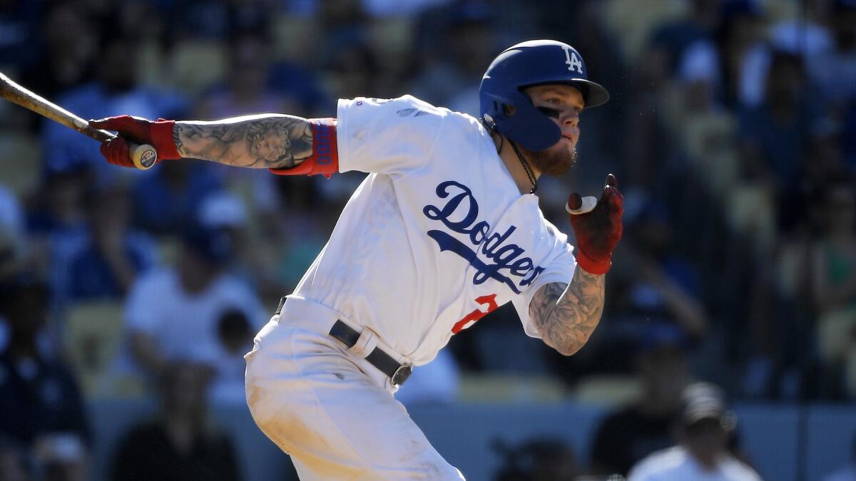 Dodgers' Alex Verdugo bats during the ninth inning against the San Diego Padres on Aug. 4 at Dodger Stadium.