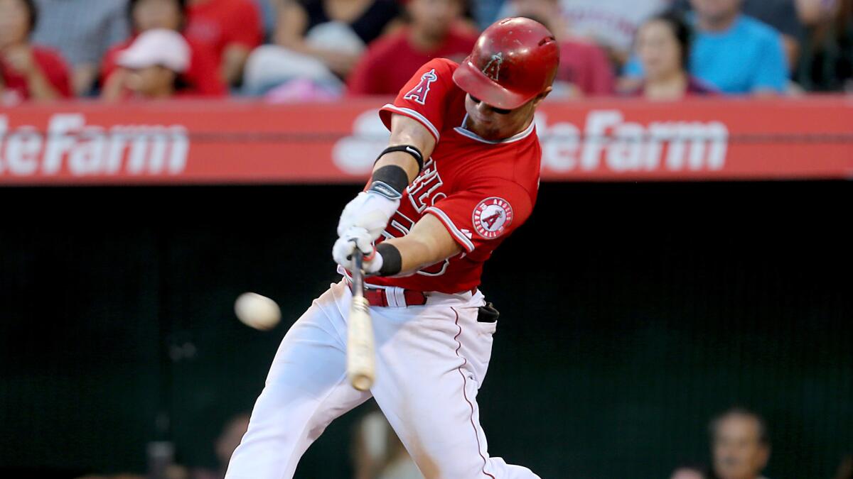 Angels right fielder Kole Calhoun connects for a double against the Oakland Athletics in the sixth inning Wednesday in Anaheim.