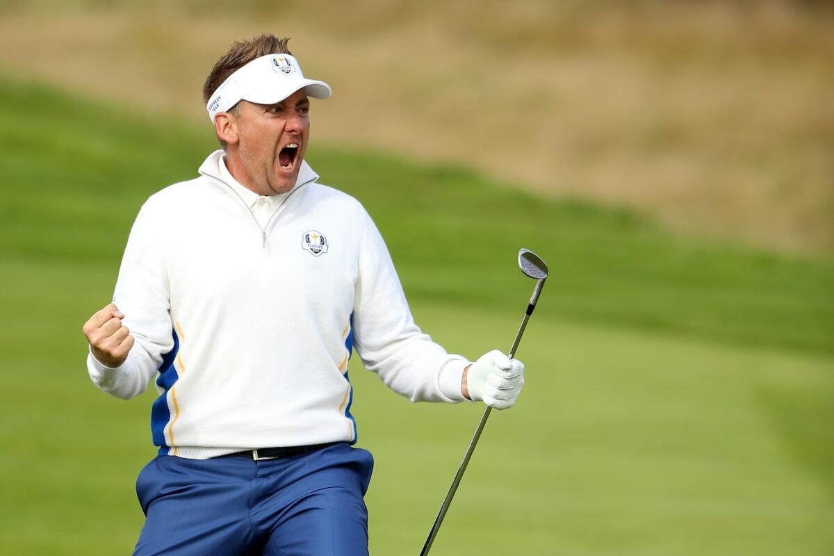 Europe's Ian Poulter celebrates after chipping in for a birdie at No. 15 during the morning fourball comptition at the Ryder Cup on Saturday at Gleneagles, Scotland.