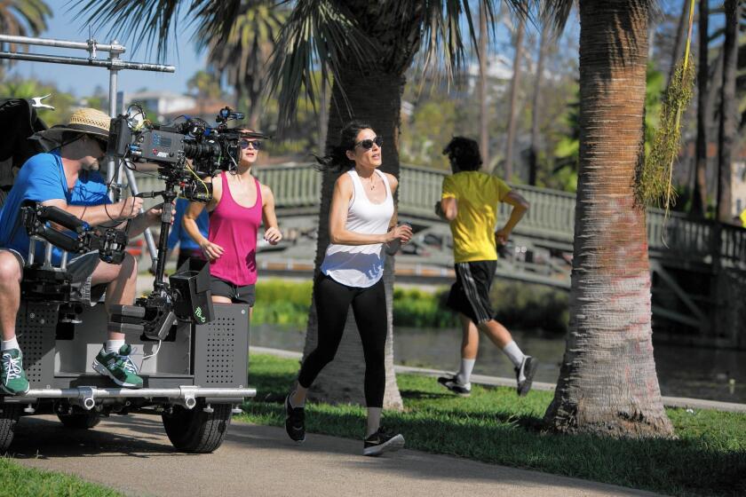 Bravo's "Girlfriends' Guide to Divorce" follows an L.A.-based self-help author Lisa Edelstein, pictured jogging at Echo Park Lake, who struggles to navigate life after splitting from her husband.