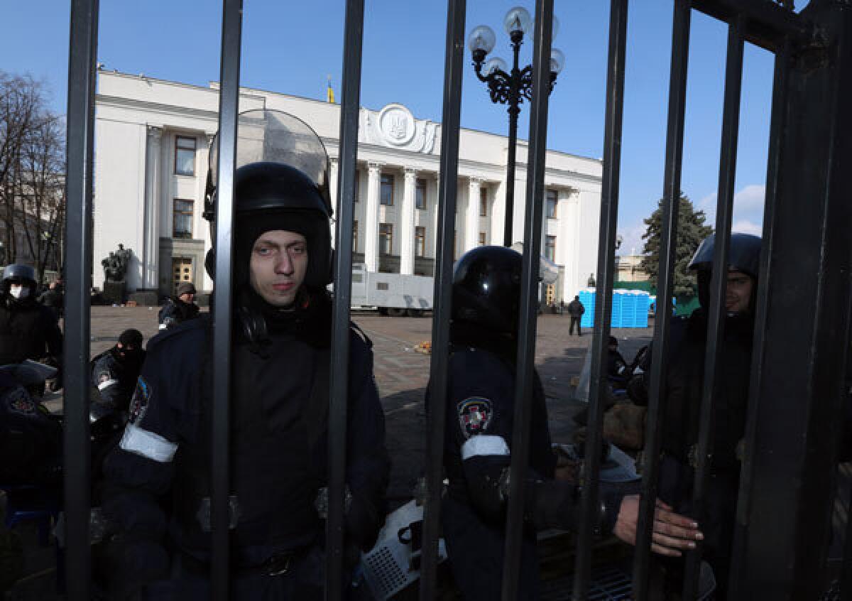 Ukrainian police protect the parliament building in Kiev.