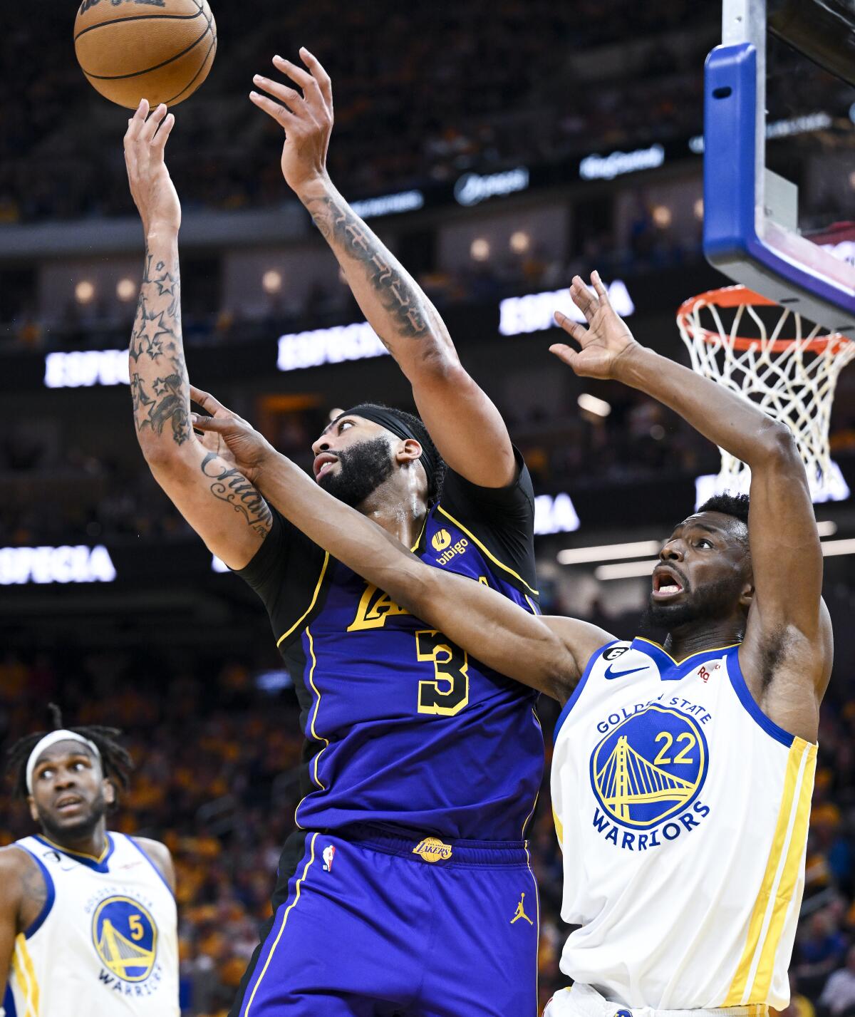 Forwards Anthony Davis of the Lakers and Andrew Wiggins of the Warriors battle for a rebound in Game 2.