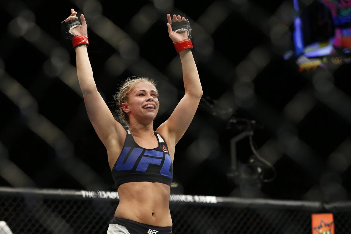 Paige VanZant celebrates after defeating Alex Chambers in their women's strawweight bout at UFC 191 on Sept. 5.
