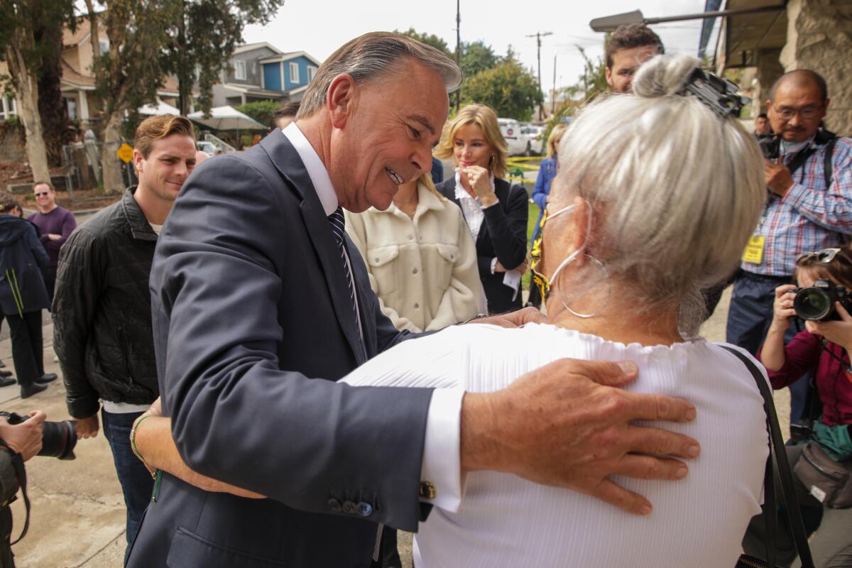Rick Caruso meets his supporters at a Boyle Heights polling station.