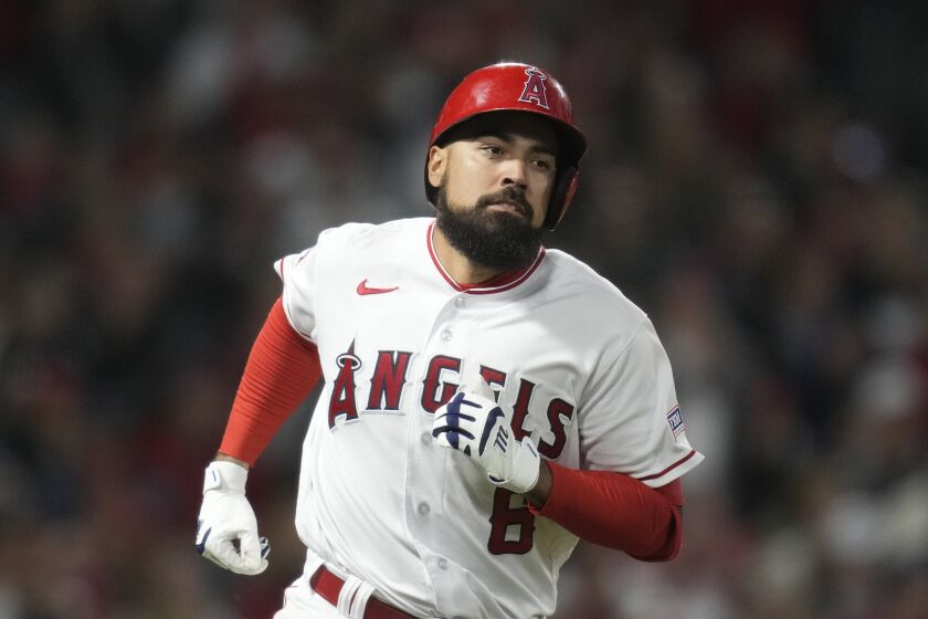 Los Angeles Angels' Anthony Rendon (6) runs to first base during a baseball game against the Toronto Blue Jays in Anaheim, Calif., Saturday, April 8, 2023. (AP Photo/Ashley Landis)