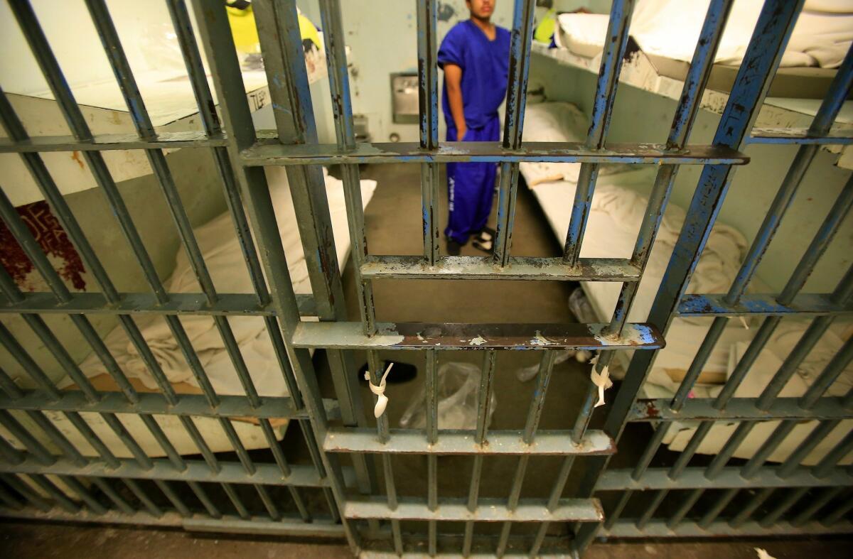 An inmate in a six-bunk cell inside Los Angeles' Men's Central Jail.