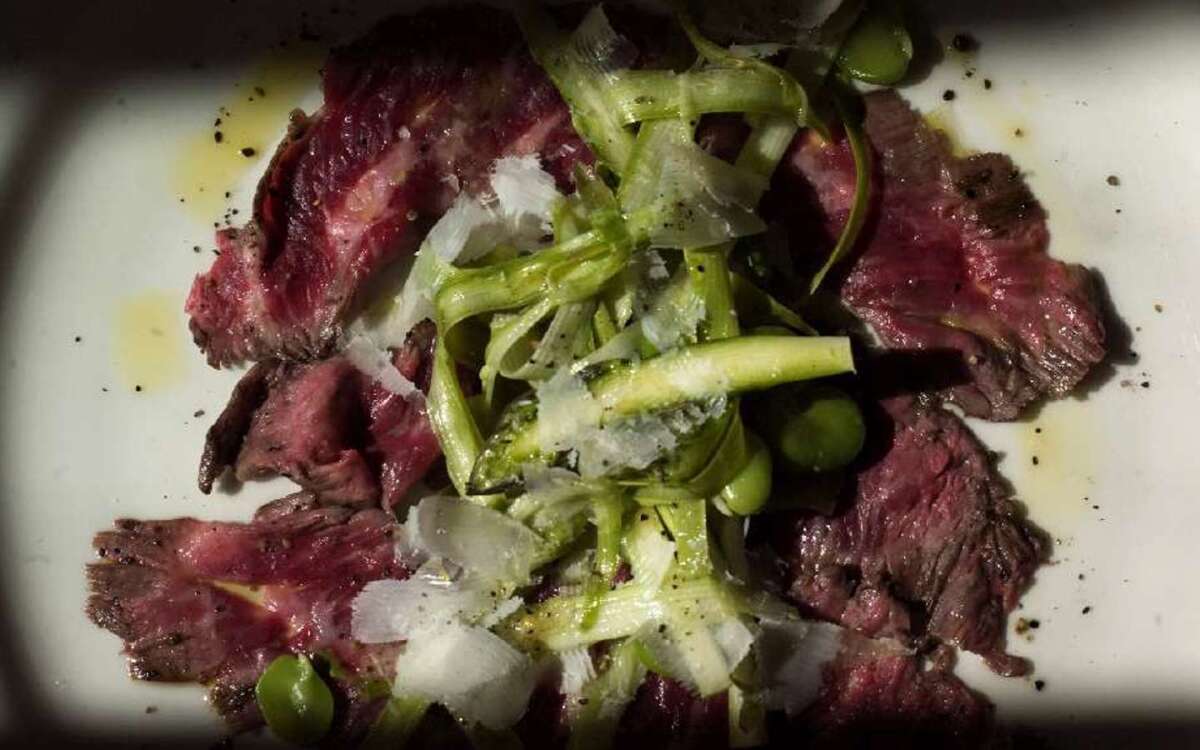 Skirt steak carpaccio with raw asparagus and fava salad