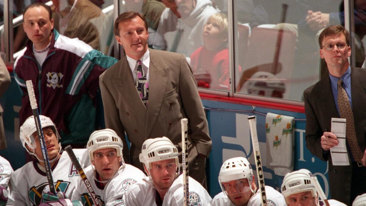 Mighty Ducks coach Ron Wilson (center) watches the action against the Kings in Anaheim on April 10, 1997.