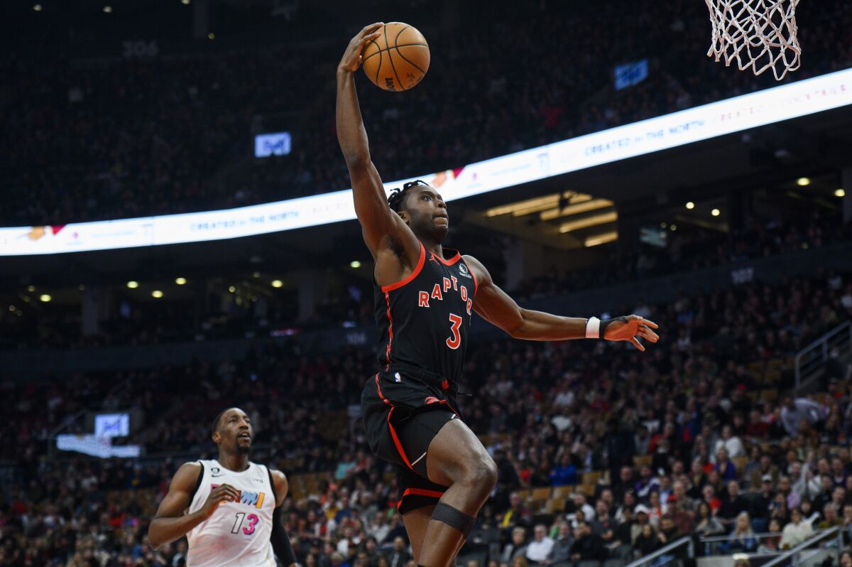 Toronto Raptors forward O.G. Anunoby goes up for a dunk against the Miami Heat during the first half of an NBA basketball game Tuesday, March 28, 2023, in Toronto. (Christopher Katsarov/The Canadian Press via AP)