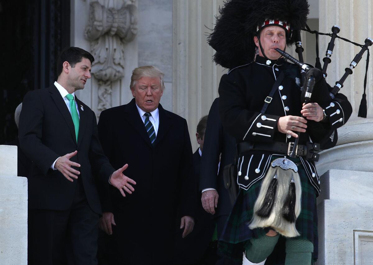 President Donald Trump and House Speaker Paul Ryan leave the House side of the Capitol after the annual Friends of Ireland luncheon on March 16, 2017.