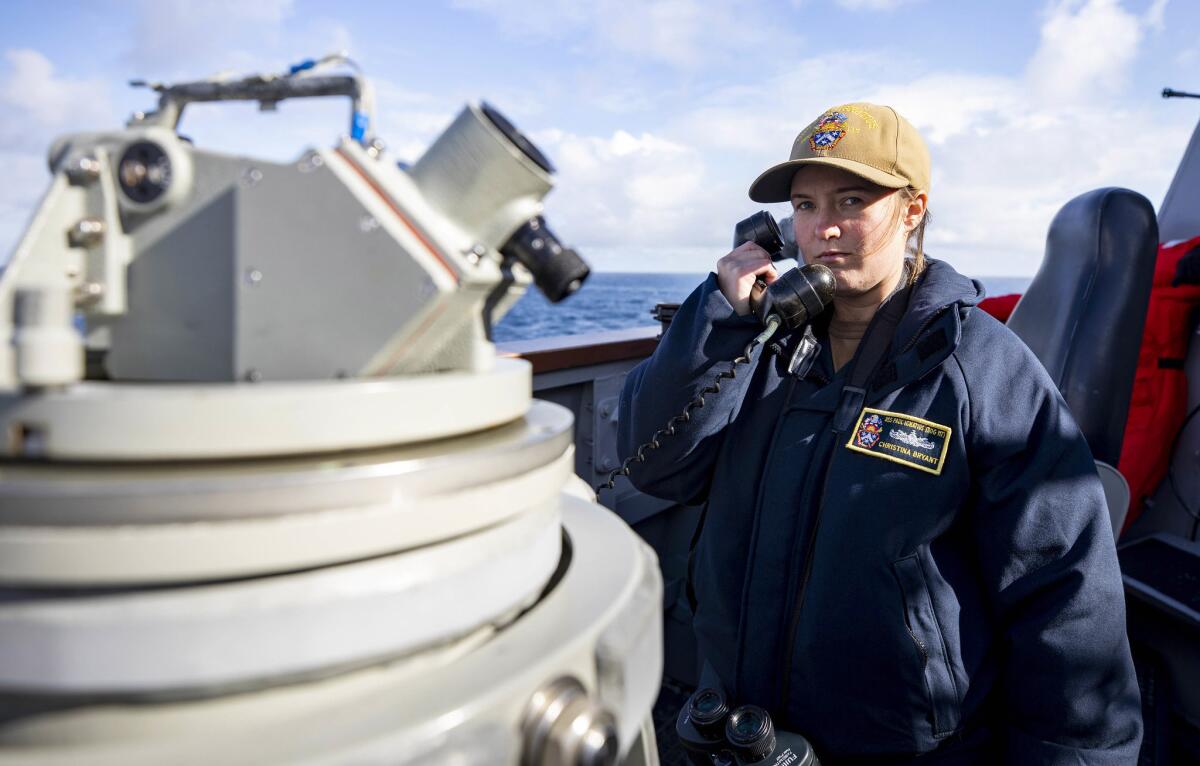Ensign Christina Bryant communicates with  bridge aboard USS Paul Ignatius May 13, 2021. 