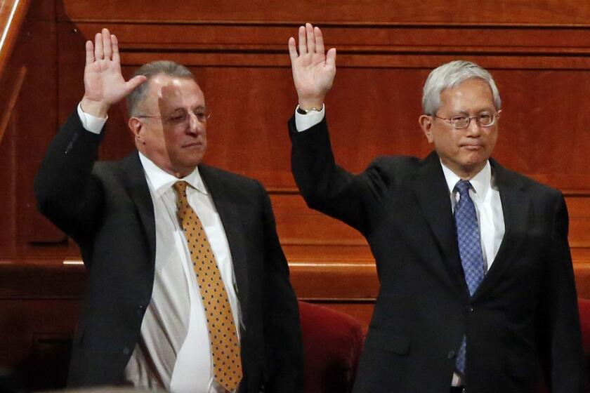 Ulisses Soares, left, of Brazil and Gerrit W. Gong, who is Chinese-American, join a panel called the Quorum of the Twelve Apostles at the start of a twice-annual conference of The Church of Jesus Christ of Latter-day Saints Saturday, March 31, 2018, in Salt Lake City. At the church conference this weekend in Salt Lake City, The Mormon church has made history and injected diversity into a top leadership panel by selecting the first-ever Latin American apostle and the first-ever apostle of Asian ancestry. (AP Photo/Rick Bowmer)