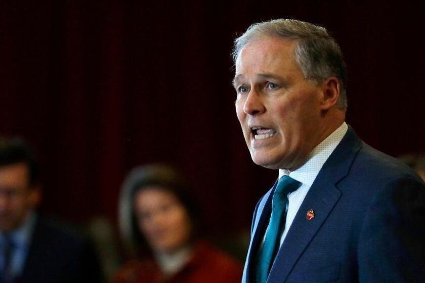 Washington Gov. Jay Inslee speaks Thursday, Feb. 14, 2019, at an event in Seattle held by the Alliance for Gun Responsibility. (AP Photo/Ted S. Warren)