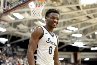 Sierra Canyon's Bronny James smiles during a high school basketball game in Springfield, Mass.