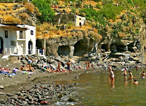 The black sand beach and sea caves at Rinella on Salina's south coast. Sicily is usually visible on the horizon. Read more: North of Sicily, Salina erupts with calm beauty