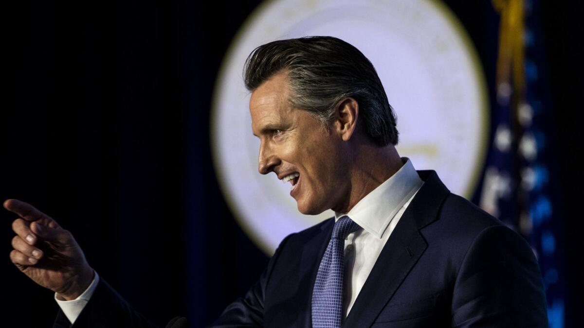 Gov. Gavin Newsom speaks at the state Capitol in Sacramento after being sworn in as California's 40th chief executive.