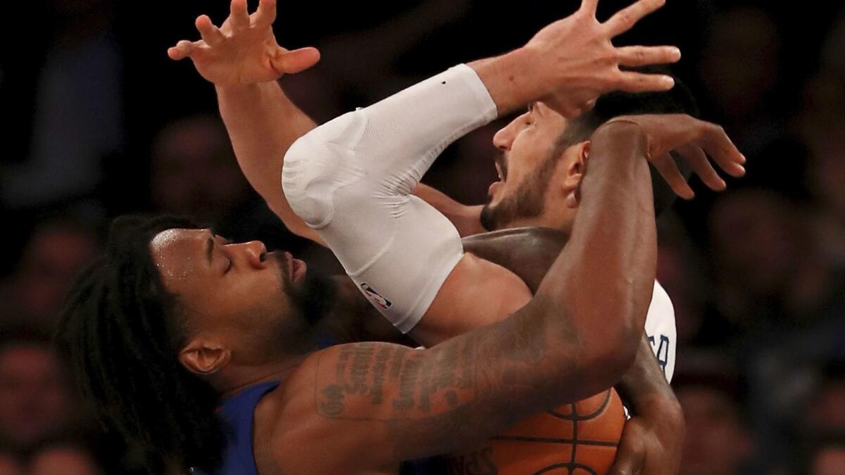 The Clippers' DeAndre Jordan, left, and New York's Enes Kanter battle for the ball on Nov. 20.