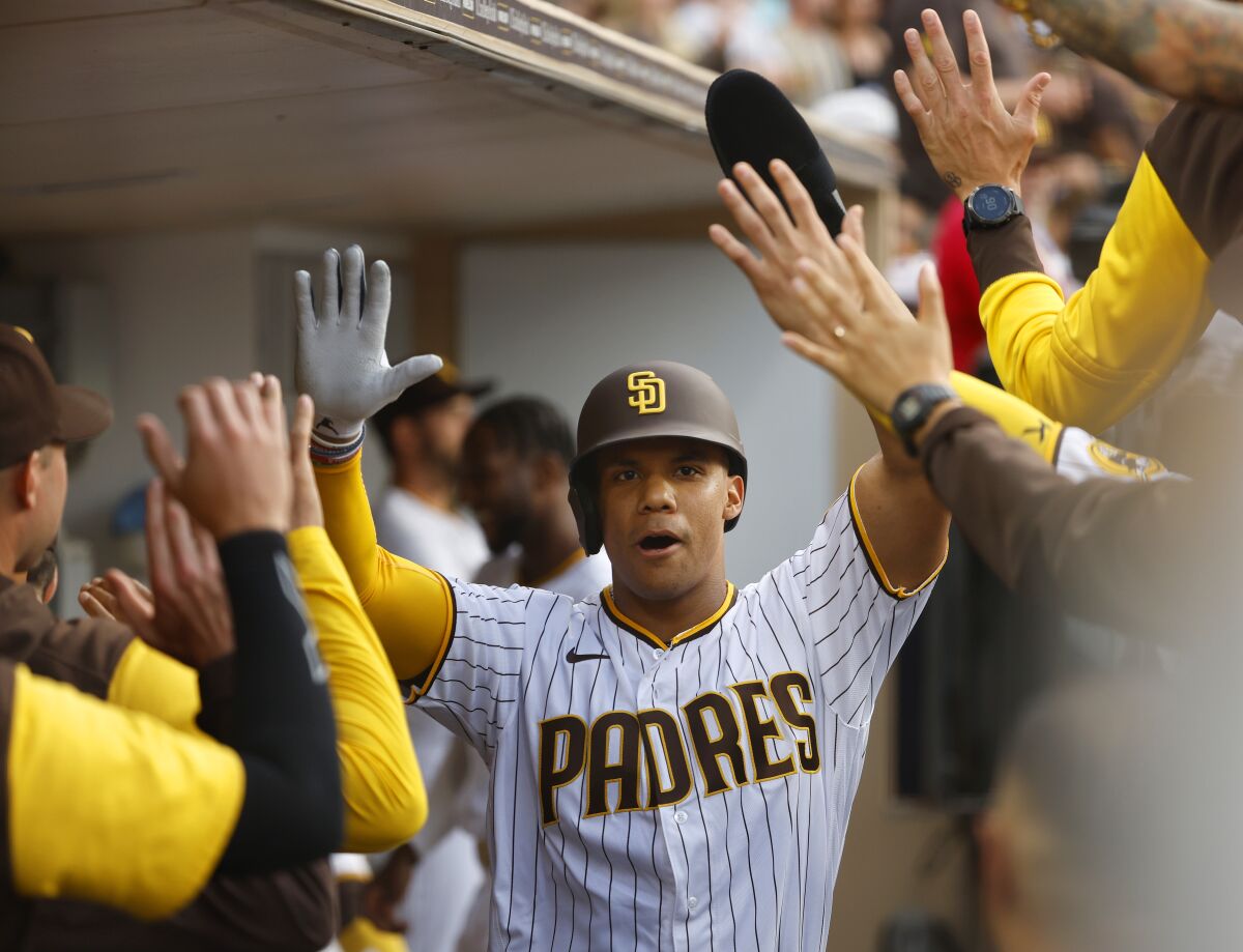 Padres outfielder Juan Soto celebrates after scoring against the Rockies on Aug. 3 at Petco Park.