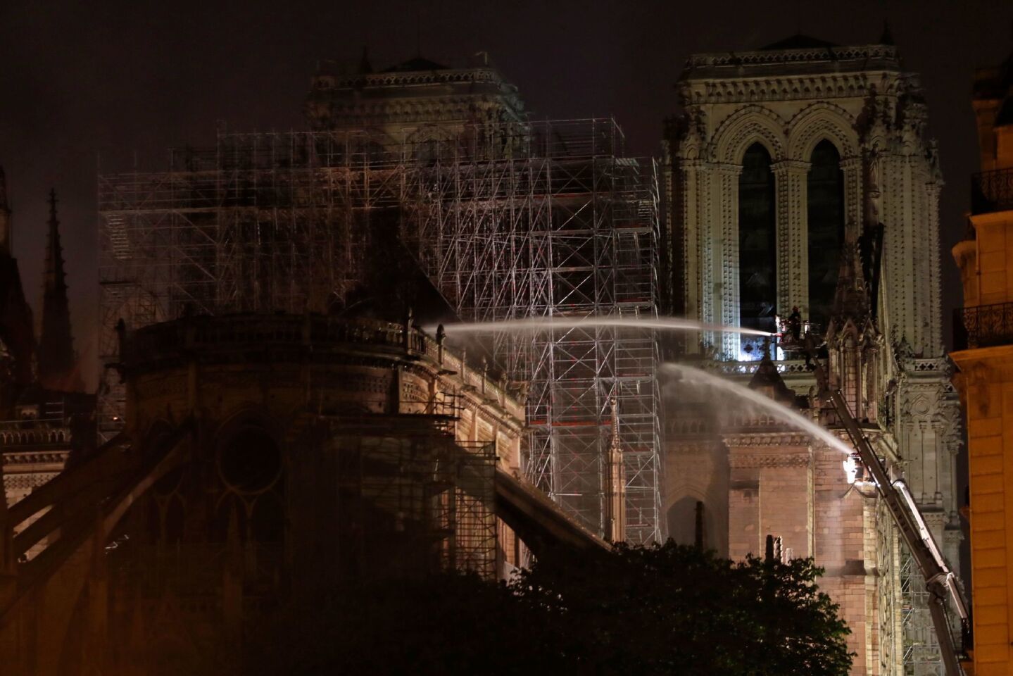 Firefighters douse the facade of Notre Dame. A ferocious and fast-moving blaze, which broke out about 6:45 p.m., destroyed large parts of the 850-year-old Gothic monument in Paris.
