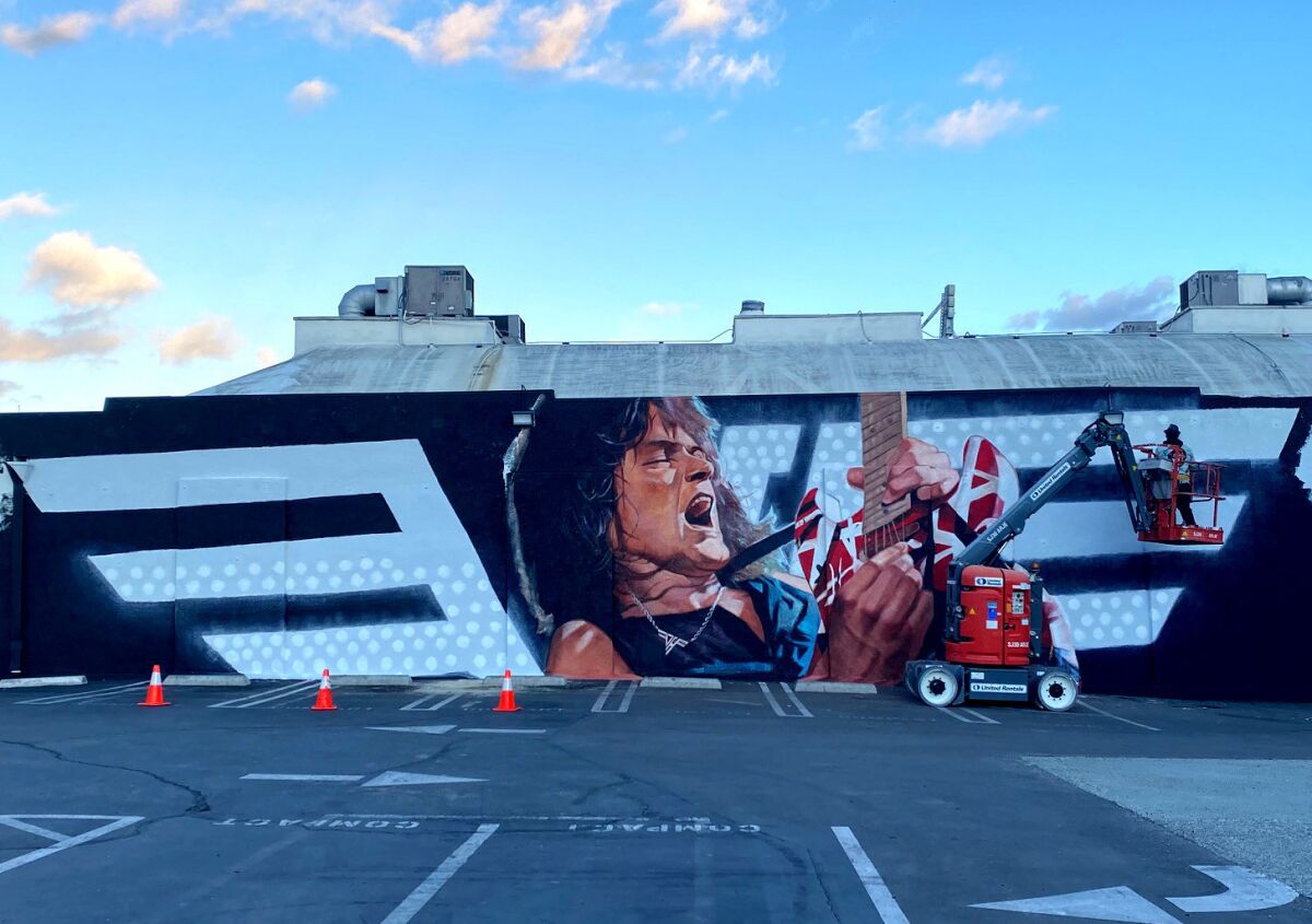 A mural of Eddie Van Halen playing guitar