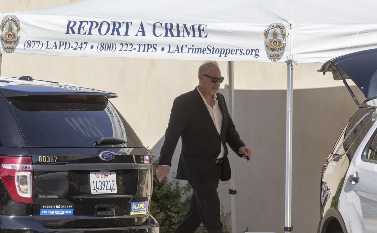 Singer Chris Brown's attorney Mark Geragos leaves Brown's Tarzana house Tuesday following a search by the Los Angeles Police Department.