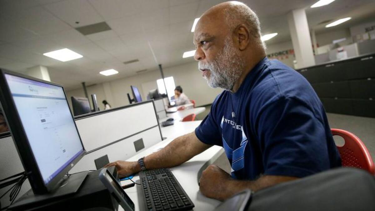 Air Force veteran Thom Brownell uses a computer to search for a job in Dallas on March 10.