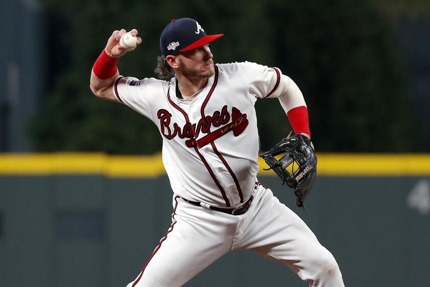 ATLANTA, GEORGIA - OCTOBER 03: Josh Donaldson #20 of the Atlanta Braves throws out the runner against the St. Louis Cardinals during the eighth inning in game one of the National League Division Series at SunTrust Park on October 03, 2019 in Atlanta, Georgia. (Photo by Kevin C. Cox/Getty Images)