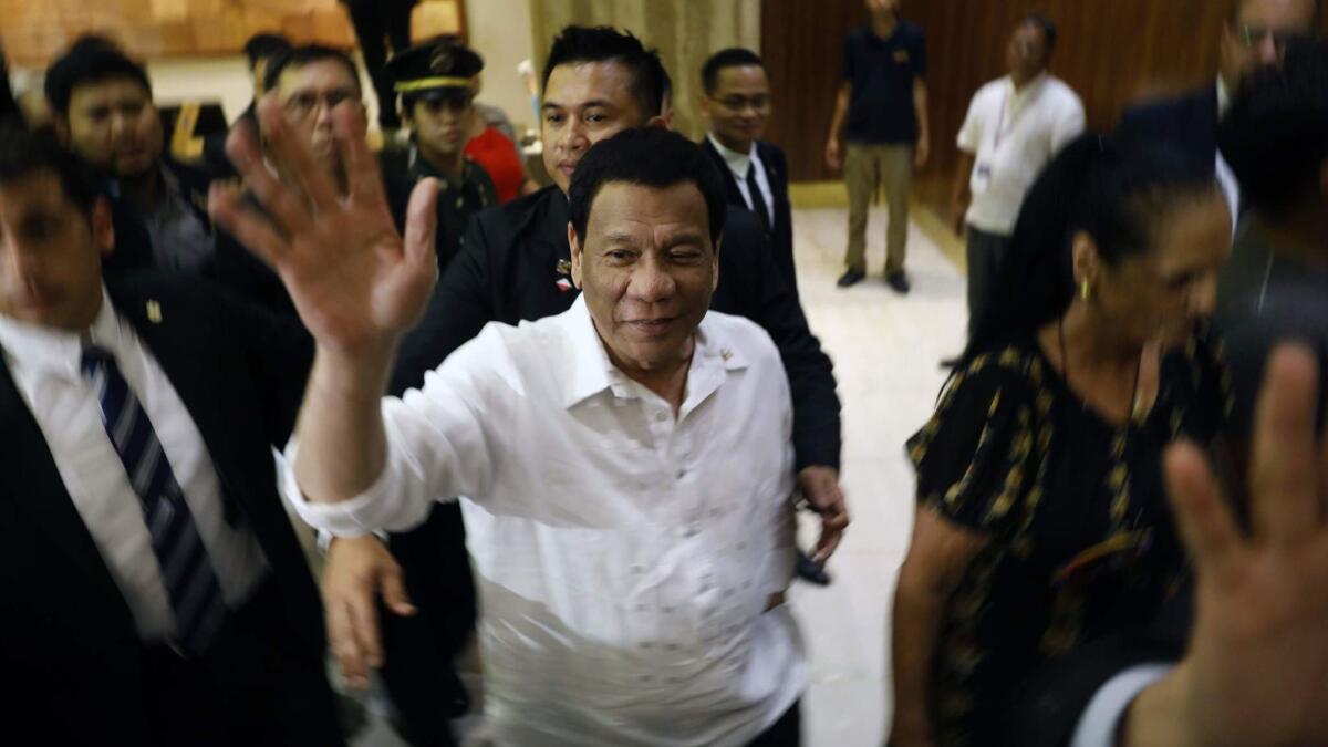 The president of the Philippines, Rodrigo Duterte, waves after arriving in Jerusalem.
