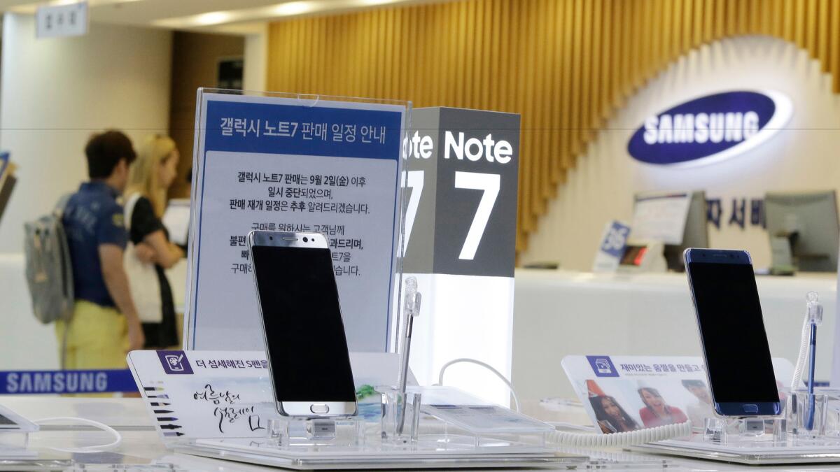 Powered-off Galaxy Note 7 smartphones are displayed Sunday at a Samsung service center in Seoul.