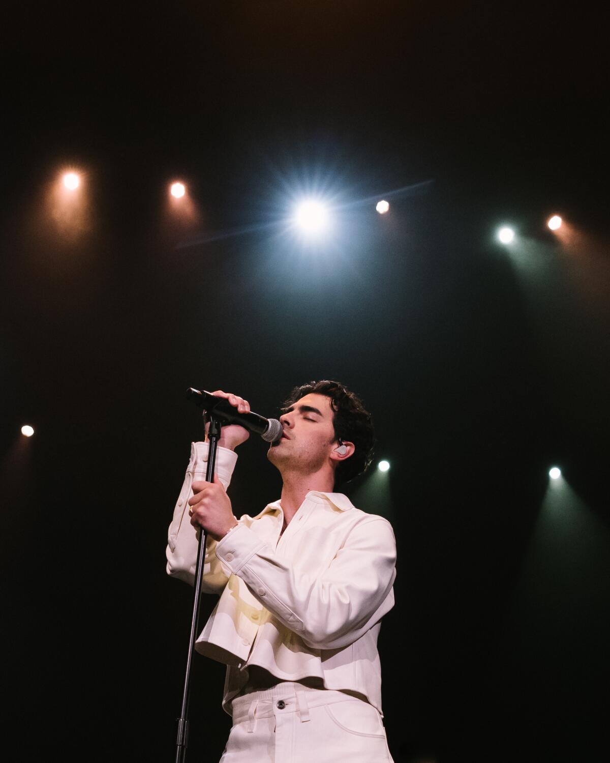 Joe Jonas sings onstage