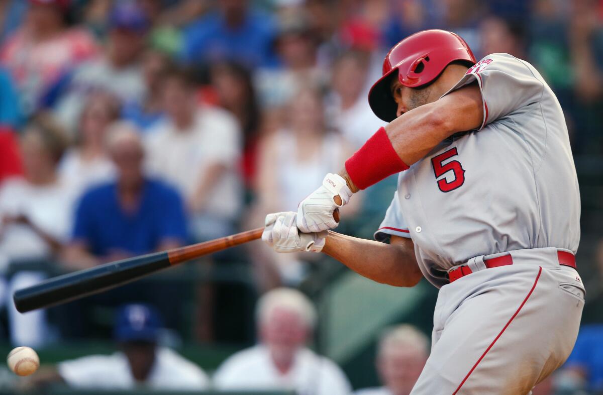 ARLINGTON, TX - JULY 05: Albert Pujols #5 of the Los Angeles Angels hits a ground ball against the Texas Rangers in the top of the fifth inning at Globe Life Park in Arlington on July 5, 2015 in Arlington, Texas. (Photo by Tom Pennington/Getty Images) ** OUTS - ELSENT, FPG - OUTS * NM, PH, VA if sourced by CT, LA or MoD **