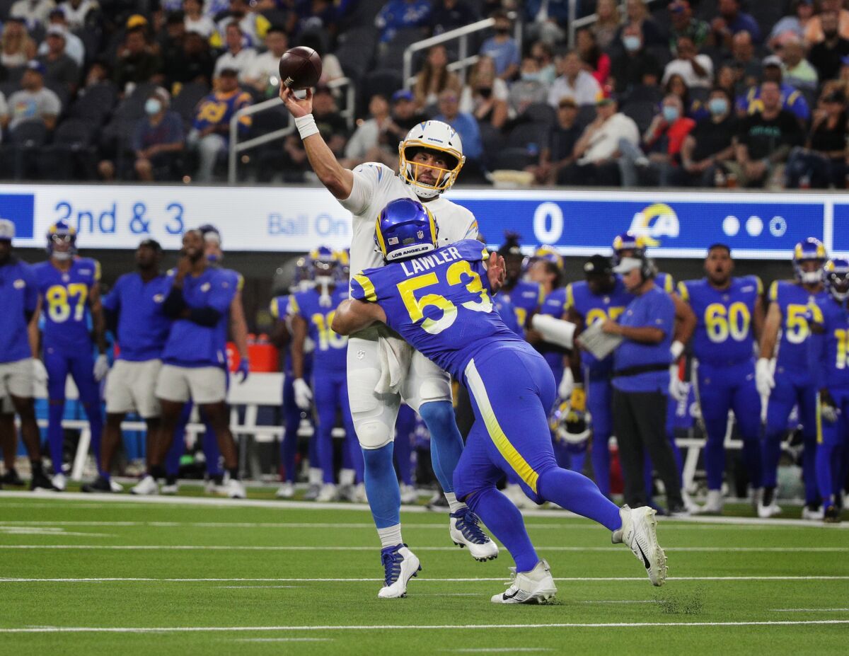 Rams linebacker Justin Lawler sacks Chargers quarterback Chase Daniel on Saturday at SoFi Stadium.