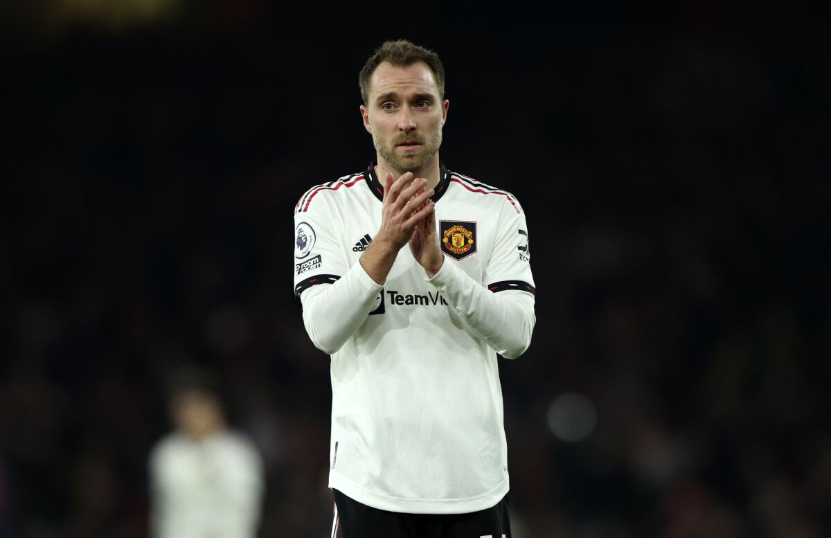 Manchester United's Christian Eriksen applauds to supporters at the end of the English Premier League soccer match between Arsenal and Manchester United at Emirates stadium in London, Sunday, Jan. 22, 2023. (AP Photo/Ian Walton)