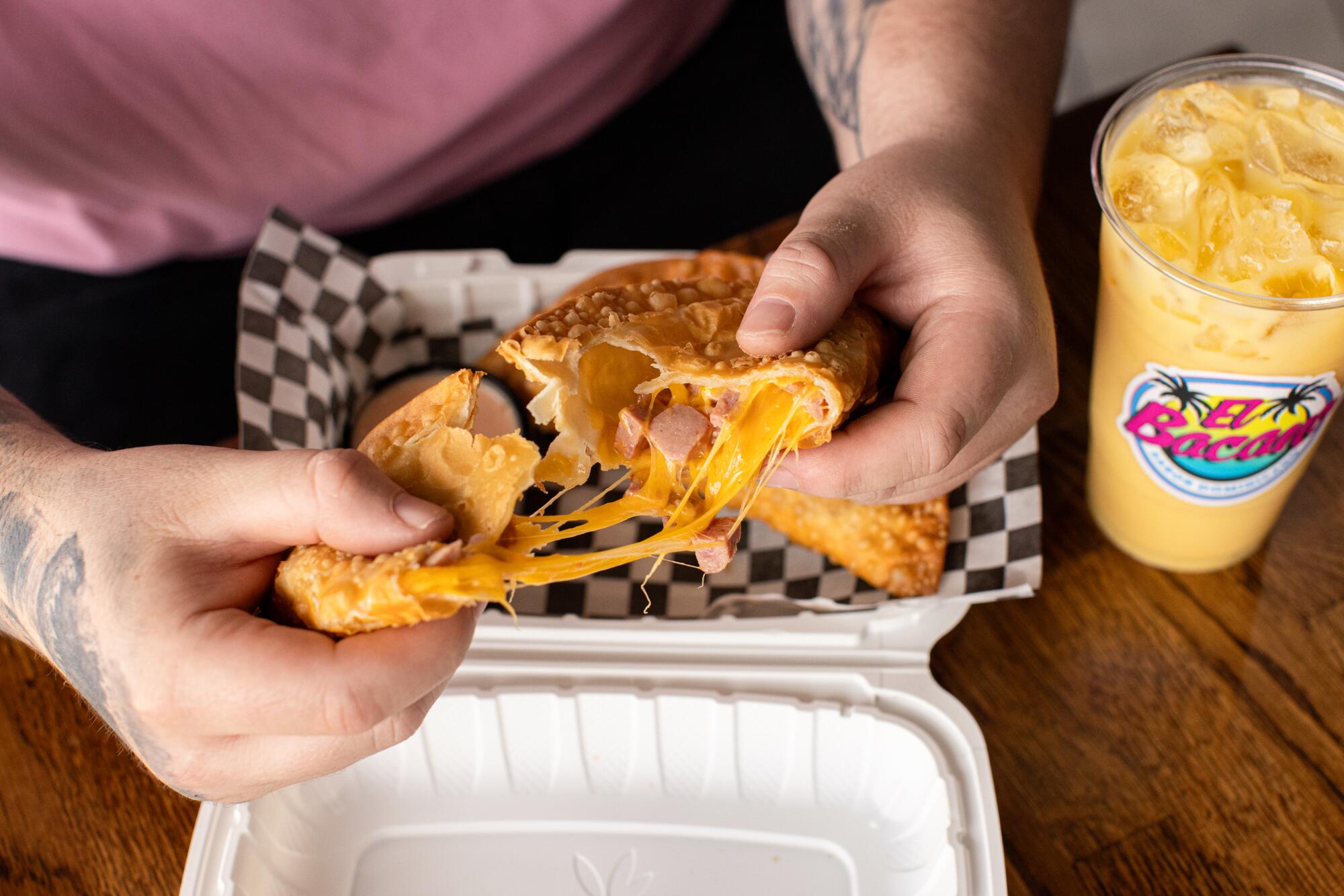 Salami and cheese empanada that opens to reveal the gooey, gooey contents. 