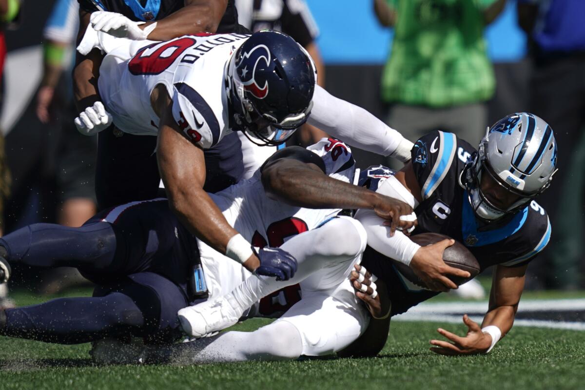 Carolina Panthers quarterback Bryce Young (9) is sacked by the Houston Texans defense during the first half of an NFL football game, Sunday, Oct. 29, 2023, in Charlotte, N.C. (AP Photo/Erik Verduzco)