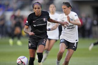 Angel City FC Sydney Leroux (2) dribbles past Bay FC Emily Menges (4) during an NWSL soccer match.