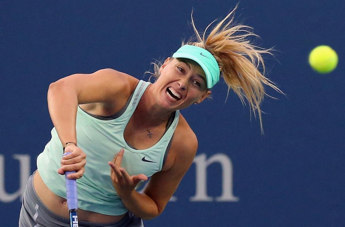 Maria Sharapova, shown playing in the Western & Southern Open last week, has decided against a name change to promote her line of candies and gum.