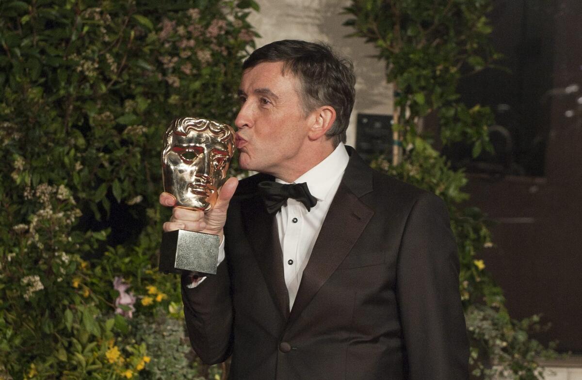 British actor Steve Coogan, who won a BAFTA award for adapted screenplay, arrives on the red carpet for 2014 EE British Academy Film Awards Gala Dinner in Central London on Feb. 16, 2014.