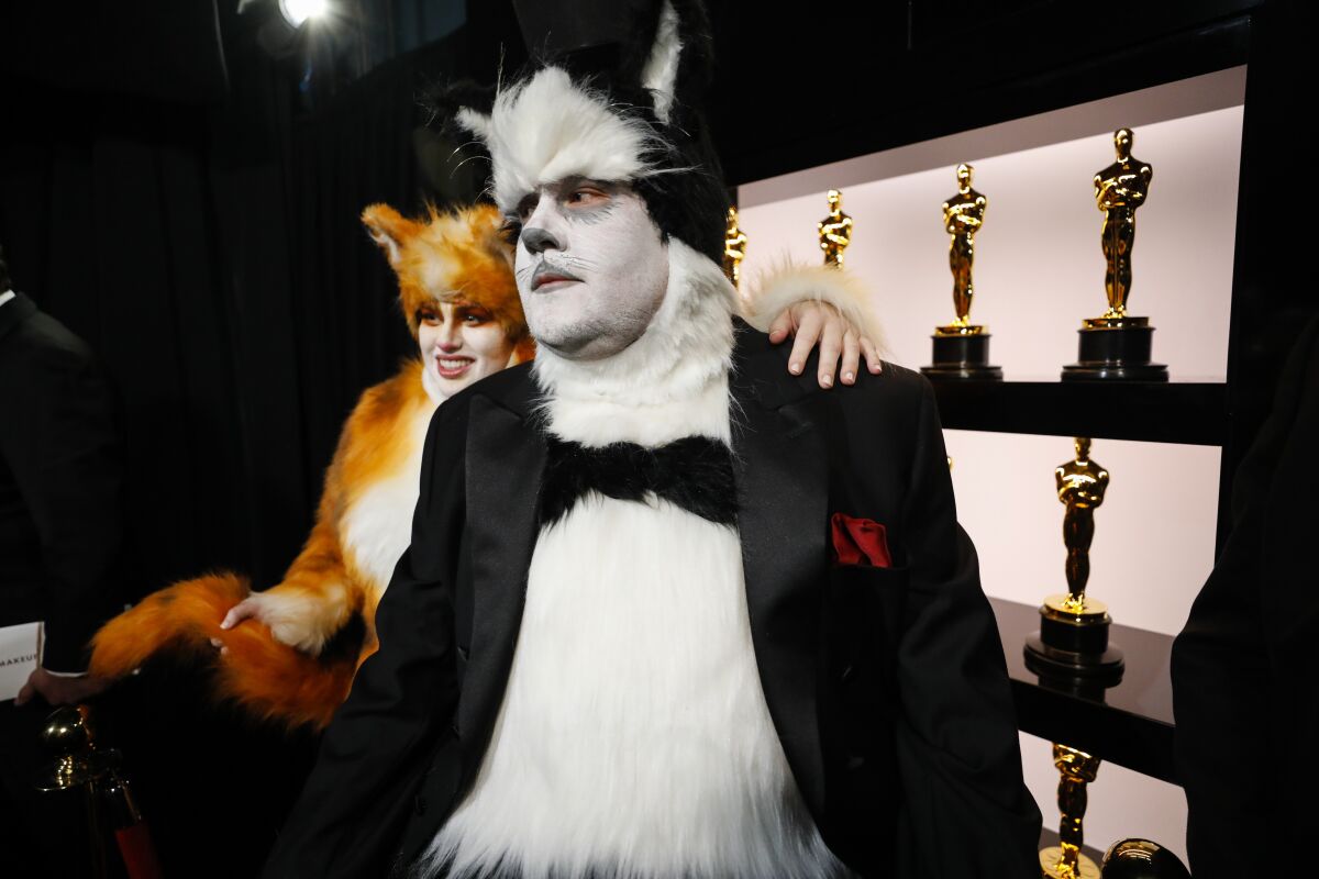 James Corden and Rebel Wilson prepare to go onstage in a self-deprecating "Cats" bit.