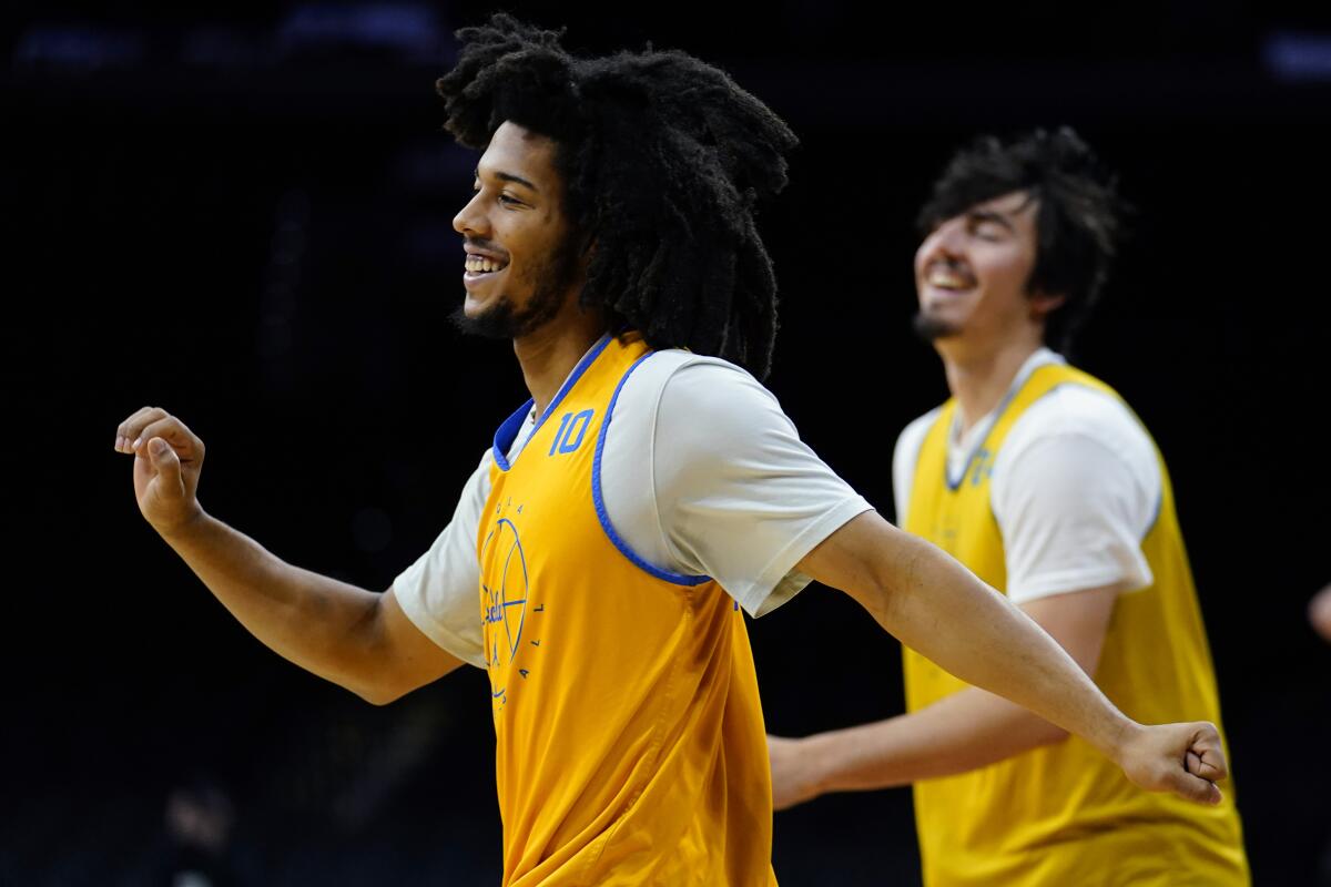 UCLA's Tyger Campbell smiles during practice for the NCAA tournament.